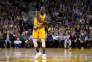 Draymond Green reacts after making a shot